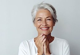 Smiling gray-haired woman with nice teeth