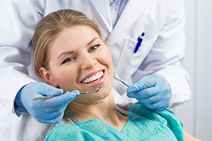 Patient smiling while visiting dentist